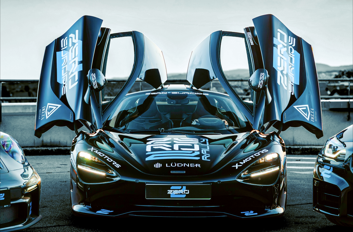 Black McLaren with doors up — ZERO2 Europe